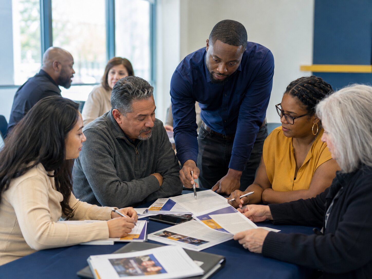 A diverse group of adults participating in a community career workshop